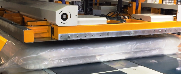 A machine that compresses the mattress from 10" to 1" thick